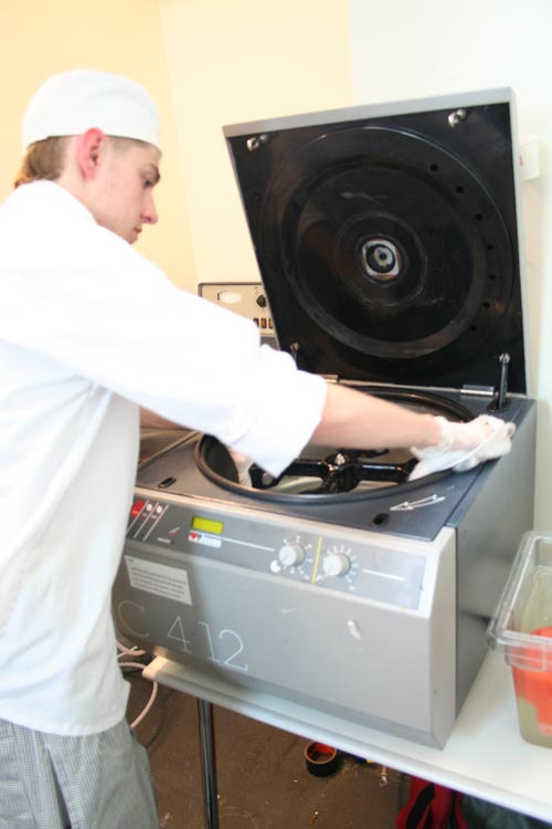 Intern sterilizing Jouan centrifuge with concentrated bleach solution