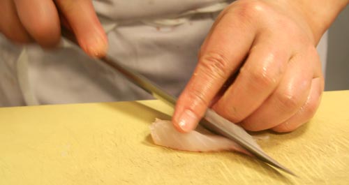 Chef Suzuki cutting fish